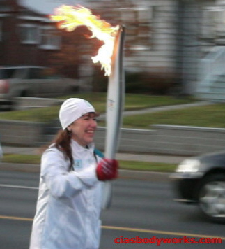 Olympic Torchbearer Cia Tweel running the Flame